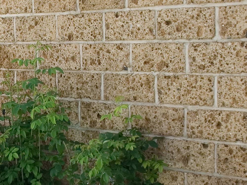 Nahaufnahme des Material Tuffsteinwand